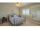 Calm bedroom featuring a bed, ceiling fan, and sunny window at 6638 S Tibet Ct, Aurora, CO 80016