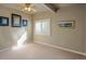 Neutral bedroom features a ceiling fan, window and plush carpet at 6638 S Tibet Ct, Aurora, CO 80016