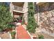 Beautiful landscaping leads to a stone-accented home with a covered patio area at 6638 S Tibet Ct, Aurora, CO 80016