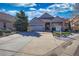 Charming single-story home with manicured landscaping, stone accents, and a spacious driveway at 6638 S Tibet Ct, Aurora, CO 80016