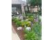 Well-maintained front yard showcasing lush flowerbeds, stone accents, and a charming home at 6638 S Tibet Ct, Aurora, CO 80016