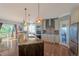 Well-appointed kitchen with a center island, stainless steel appliances, and elegant finishes at 6638 S Tibet Ct, Aurora, CO 80016