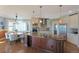 Spacious kitchen with granite countertops, stainless steel appliances, and natural lighting at 6638 S Tibet Ct, Aurora, CO 80016