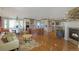 Inviting living area with an open-concept design, hardwood floors, and fireplace at 6638 S Tibet Ct, Aurora, CO 80016