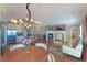 Bright and airy living space with fireplace, modern lighting, open to kitchen, and hardwood flooring at 6638 S Tibet Ct, Aurora, CO 80016