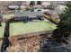 Stunning aerial view of a property featuring a large backyard, covered patio, privacy fence, and mature trees in a serene setting at 3461 S Ivy Way, Denver, CO 80222