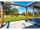 Backyard patio with a wooden pergola and a view of the expansive lawn at 3461 S Ivy Way, Denver, CO 80222