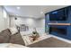 Finished basement with a cozy seating area, electric fireplace, and contemporary decor at 3461 S Ivy Way, Denver, CO 80222