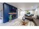 Finished basement featuring a fireplace, flat-screen TV, and comfortable seating at 3461 S Ivy Way, Denver, CO 80222