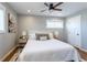 Bright bedroom with a ceiling fan, stylish lighting, and contemporary decor at 3461 S Ivy Way, Denver, CO 80222
