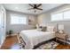 Bright bedroom with a ceiling fan, stylish lighting, and contemporary decor at 3461 S Ivy Way, Denver, CO 80222