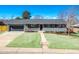 Beautifully updated home with attached garage, and manicured lawn boasts inviting curb appeal in a Gathering-friendly neighborhood at 3461 S Ivy Way, Denver, CO 80222