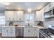 Beautiful kitchen with stainless appliances, subway tile backsplash, and ample counter space at 3461 S Ivy Way, Denver, CO 80222
