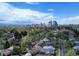 Scenic aerial view of a residential area with the city skyline and mountains in the background at 458 S Downing St, Denver, CO 80209