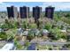 Aerial view of a neighborhood, apartment towers, and city skyline at 458 S Downing St, Denver, CO 80209