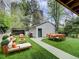 A backyard with a garage, outdoor seating and patio at 458 S Downing St, Denver, CO 80209