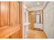 Bathroom featuring a pedestal sink, hardwood floors, and an open door to another room at 458 S Downing St, Denver, CO 80209