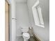 Bright bathroom with a window and neutral-toned walls at 458 S Downing St, Denver, CO 80209