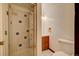 Well-lit bathroom featuring a tiled shower and neutral-toned fixtures, enhancing a clean, modern feel at 458 S Downing St, Denver, CO 80209