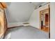Charming bedroom with vaulted ceilings, neutral carpet, and exposed brick at 458 S Downing St, Denver, CO 80209