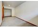 Large, carpeted room with a walk-in closet and adjacent space, perfect for creating a custom living area at 458 S Downing St, Denver, CO 80209
