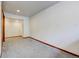 Spacious carpeted room featuring recessed lighting and an open layout, offering versatility and comfort at 458 S Downing St, Denver, CO 80209