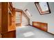 Bedroom with built-in shelving, exposed brick, and unique windows at 458 S Downing St, Denver, CO 80209