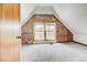 Cozy bedroom featuring a brick accent wall and a large window at 458 S Downing St, Denver, CO 80209
