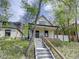 Inviting home exterior showcasing the well-maintained yard and unique architectural details at 458 S Downing St, Denver, CO 80209