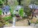 Charming home with a front yard, featuring mature trees and a brick porch, aerial view at 458 S Downing St, Denver, CO 80209