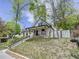 Charming front exterior of home with peaked roof, brick facade, and welcoming front porch at 458 S Downing St, Denver, CO 80209