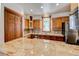 Well-appointed kitchen featuring custom cabinetry, granite countertops, and stainless steel appliances at 458 S Downing St, Denver, CO 80209