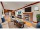 Cozy living room with a brick fireplace, built-in shelving, and comfortable furnishings at 458 S Downing St, Denver, CO 80209