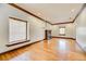 Bright living room showcasing large windows, fireplace, and gleaming hardwood floors at 458 S Downing St, Denver, CO 80209