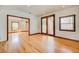 Large, bright living room with hardwood floors, and walkout patio at 458 S Downing St, Denver, CO 80209