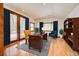 Bright office with hardwood floors, a large desk, and a walkout deck at 458 S Downing St, Denver, CO 80209