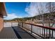 View from the wood deck showcasing a scenic view of the surrounding landscape and mountains at 9019 Armadillo Trl, Evergreen, CO 80439