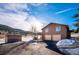 Exterior view of a home with a driveway and a two-car garage at 9019 Armadillo Trl, Evergreen, CO 80439