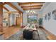 Bright dining room featuring exposed beams, a stone tile floor, and a large window with scenic views at 1420 Sierra Dr, Boulder, CO 80302