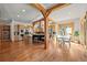 Open kitchen and dining area with wood beams, stainless appliances, and lots of natural light at 1420 Sierra Dr, Boulder, CO 80302
