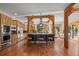 Gourmet kitchen featuring custom wood cabinetry, a large center island with seating, and hardwood floors at 1420 Sierra Dr, Boulder, CO 80302