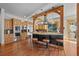 Bright kitchen with custom cabinets, stainless appliances, and large island with bar seating at 1420 Sierra Dr, Boulder, CO 80302