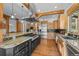 Gourmet kitchen with stainless steel appliances, custom cabinets, and center island with granite countertops at 1420 Sierra Dr, Boulder, CO 80302