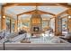 Bright living room boasting a stone fireplace, wood beams, and large sliding doors at 1420 Sierra Dr, Boulder, CO 80302