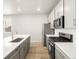 Stainless steel appliances and quartz countertops in the bright kitchen at 765 N Tibet St, Aurora, CO 80018