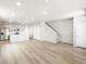 Bright open floor plan between kitchen and living room with stairs at 765 N Tibet St, Aurora, CO 80018
