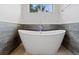 Elegant bathroom showcasing a freestanding tub with stylish fixtures at 2533 N Emerson St, Denver, CO 80205