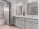 Modern bathroom featuring a double vanity with stylish mirrors and a shower/tub combination at 2533 N Emerson St, Denver, CO 80205