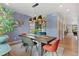 Stylish dining room with modern lighting, hardwood floors, and comfortable seating arrangement at 2533 N Emerson St, Denver, CO 80205