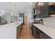 Modern kitchen with stainless steel appliances, large island, and sleek cabinetry for ample storage at 2533 N Emerson St, Denver, CO 80205